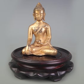 A SMALL BRONZE SHAKYAMUNI BUDDHA STATUE