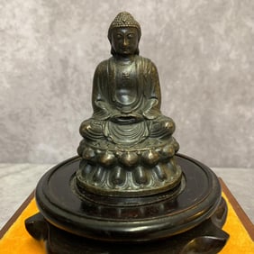 A SMALL BRONZE MAITREYA BUDDHA STATUE