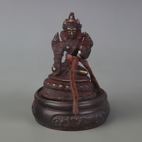 A SMALL TIBETAN BUDDHIST BRONZE STATUE