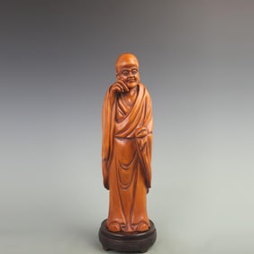A LARGE BOXWOOD CARVED STANDING BUDDHA FIGURE STATUE