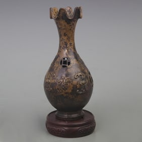 A FINE BRONZE FLOWER PATTERN BOTTLE