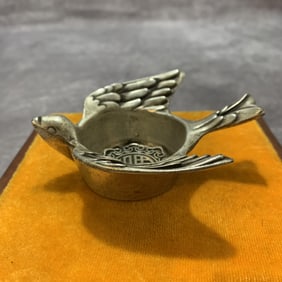 A FINE WHITE BRONZE PIGEON FIGURE CUP