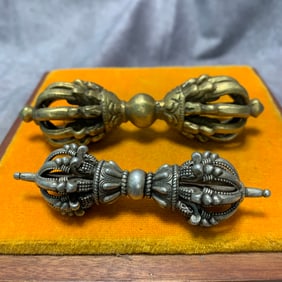 PAIR OF TIBETAN BUDDHIST BRONZE RITUAL IMPLEMENTS