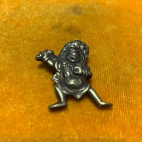 A SMALL BRONZE TIBETAN PENDANT