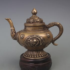 A FINE BRONZE OPENWORK DRAGON-PATTERNED TEAPOT