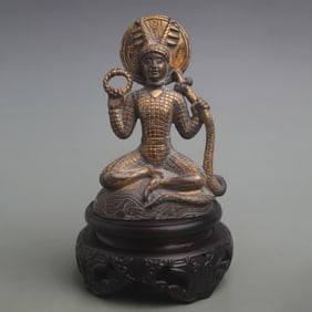 SERPENT-SHAPED BUDDHA STATUE