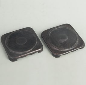 PAIR OF EBONY WOOD CARVED ROUND BASES