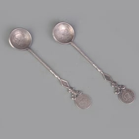 PAIR OF SILVER PLATED COIN FIGURE SPOONS