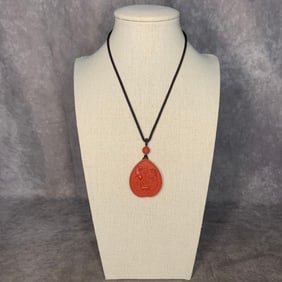 A FINE CHINESE CINNABAR CARVED NECKLACE