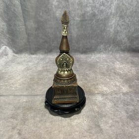 A FINE BRONZE TIBETAN STUPA INLAID WITH SILVER