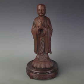A TALL CAMPHORWOOD BUDDHA STATUE