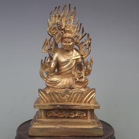 A FINE GILT BRONZE ACALA BODHISATTVA STATUE