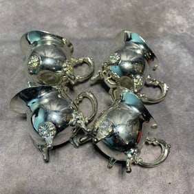 GROUP OF COPPER-SHEATHED SILVER MILK CUPS