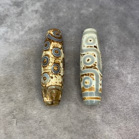 GROUP OF TWO TIBETAN DZI BEAD