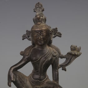 A BINE GILT BRONZE GREEN TARA RIDING A BEAST STATUE