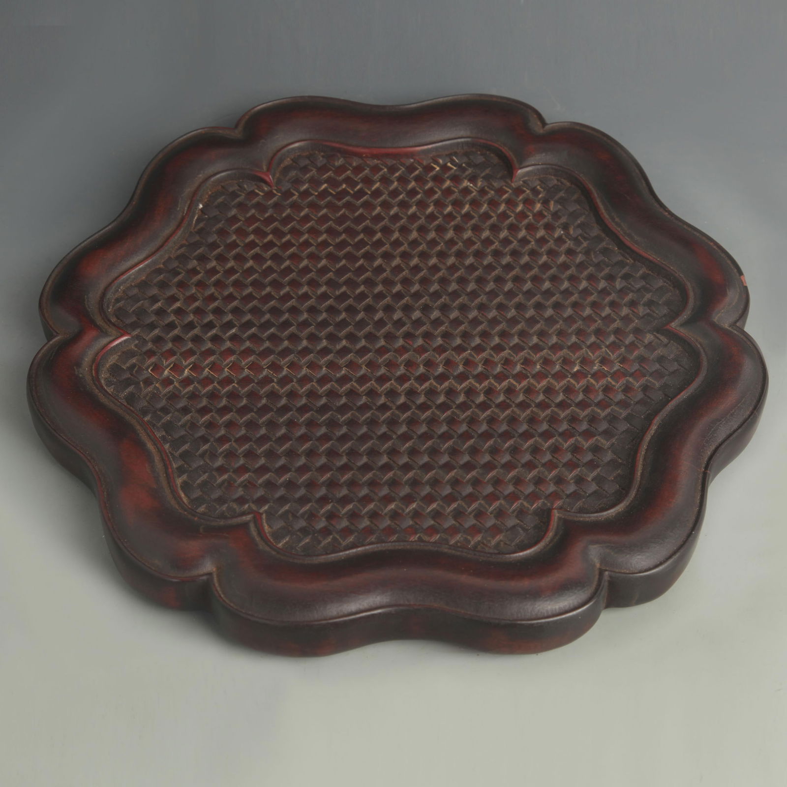 A FINE EBONYWOOD AND CARVED TEA TRAY: 20th Century; High: 1.00 inch; Diameter: 13.0 inch