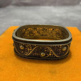 A FINE WHITE BRONZE MADE BRANGLE