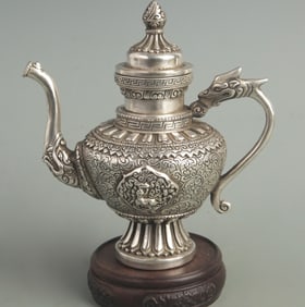 A FINE WHITE BRONZE FIGURE PATTERN TIBETAN EWER