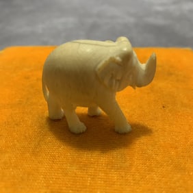 A FINE OX HORN MADE SMALL ELEPHANT FIGURE