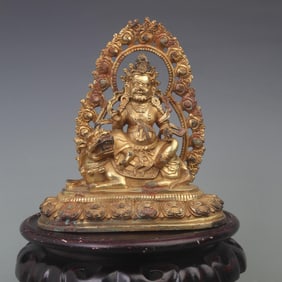 A FINE BRONZE HAI BAO TIAN WANG STATUE