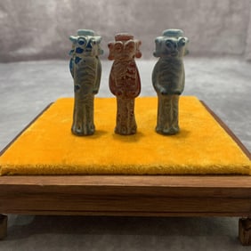 GROUP OF THREE SMALL GLASS HUMAN FIGURE