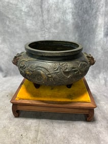 XUANDE ERA GILT BRONZE THREE-LEGGED CENSER WITH LION HANDLES AND DRAGON PATTERNS