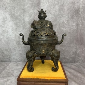 A FINE ELEPHANT-FOOT BRONZE CENSER WITH ELEPHANT TOP