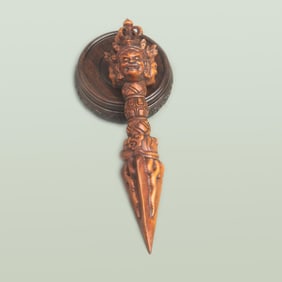 A DETAIL AND FINELY CARVED HUANG YANG WOOD VAJRA