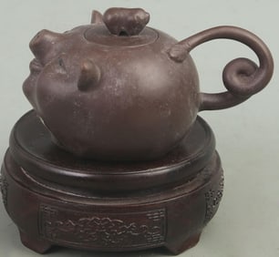 A FINELY CARVED ZI SHA TEAPOT