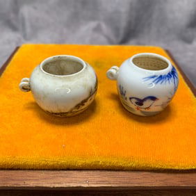 PAIR OF FAMILLE ROSE PORCELAIN BIRD FEEDERS