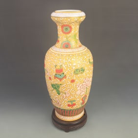 FAMILLE ROSE YELLOW GROUND EIGHT TREASURES PATTERN PORCELAIN VASE