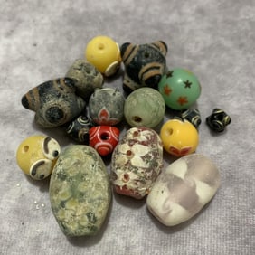 GROUP OF GLASS MADE BEADS