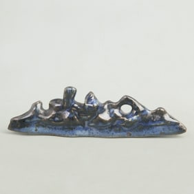 A FINE BLUE GLAZED MOUNTAIN-SHAPED PORCELAIN PEN STAND