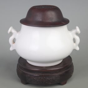 A WHITE GLAZED PORCELAIN INCENSE BURNER WITH RED WOOD COVER