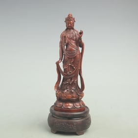 A FINE HUANGYANG WOOD GUANYIN FIGURINE