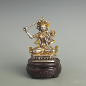 A FINELY MADE BRONZE GILT AND GOLD-PLATED STATUE OF MANJUSHRI BODHISATTVA