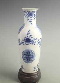 BLUE AND WHITE VASE WITH FLOWER AND LONGEVITY DESIGN