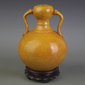 YELLOW-GLAZED RUYI-HANDLED PORCELAIN VASE WITH INCISED PHOENIX DECORATION
