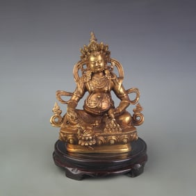 A FINE BRONZE YELLOW GOD OF WEALTH STATUE