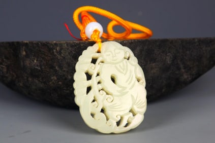 A FINELY CARVED HETIAN PALE CELADON JADE PENDANT PENDANT