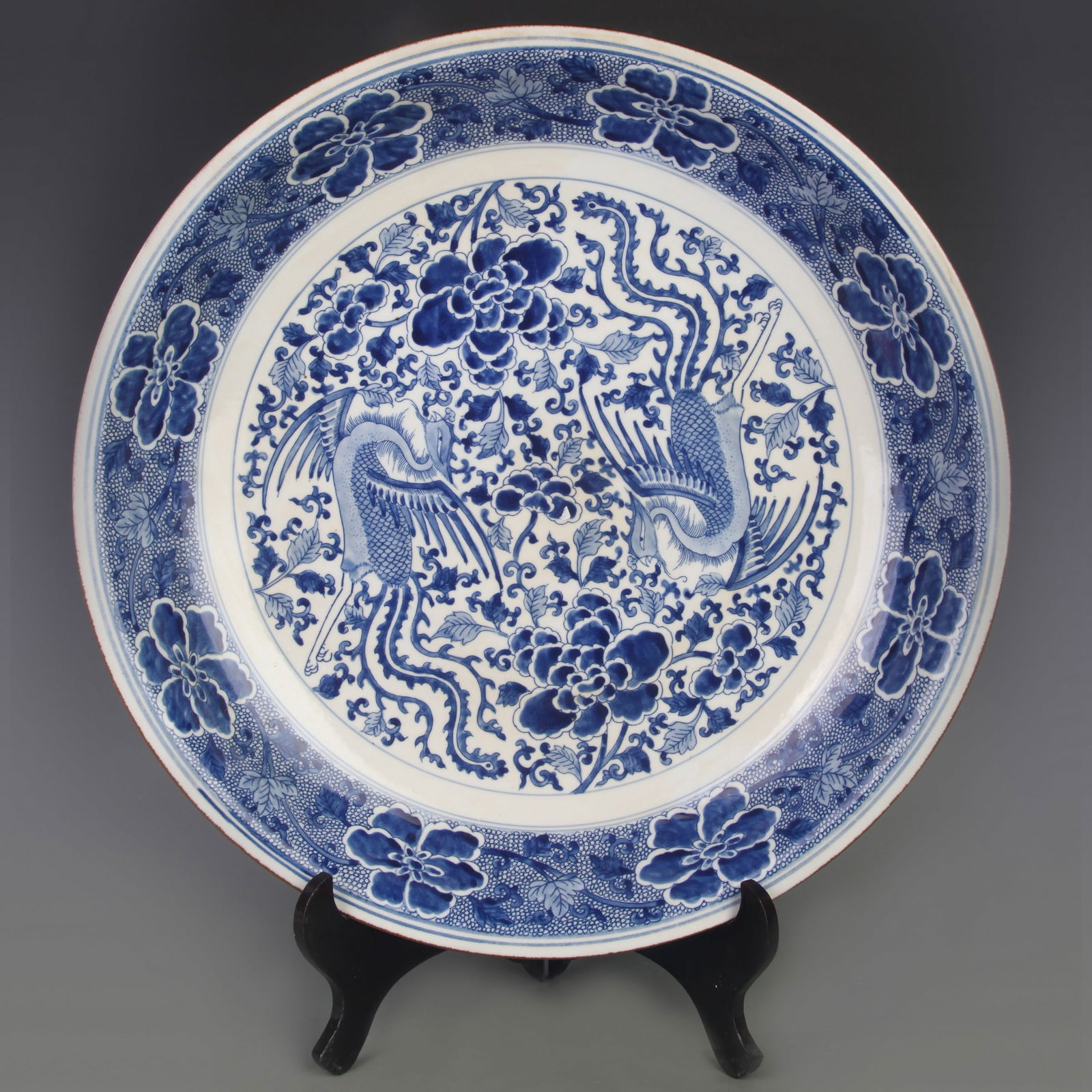 LARGE BLUE AND WHITE PHOENIX AND FLORAL PORCELAIN PLATE: Qing Dynasty Kang Xi Period; : Diameter: 17.8 inch; High: 3.3 inch;