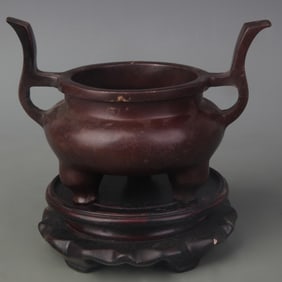 A FINE BRONZE TRIPOD CENSER WITH TALL HANDLE