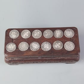 GROUP OF TWELVE SMALL CHINESE COIN