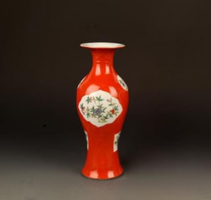A FINE RED GROUND FAMILLE ROSE PATTERN PORCELAIN GUANYIN VASE