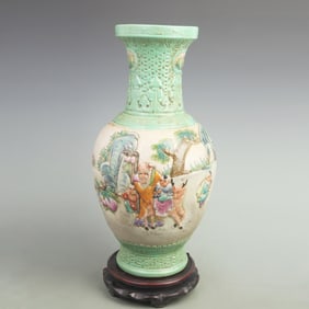 FAMILLE ROSE CARVED VASE WITH BOY OFFERING LONGEVITY DESIGN