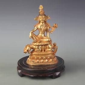 A FINE BRONZE FREE STANDING GUANYIN STATUE