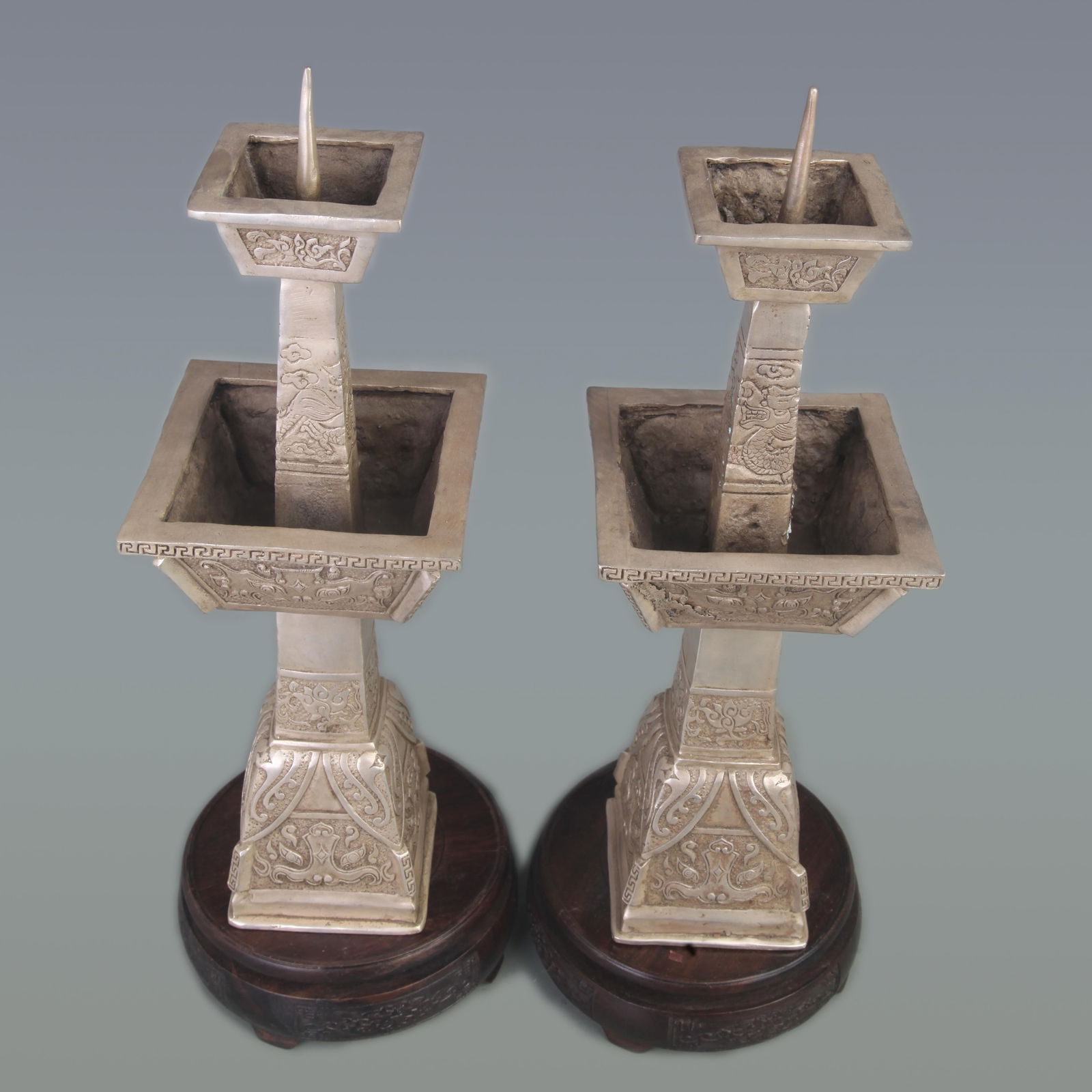 RARE PAIR OF WHITE BRONZE DRAGON PATTERN CANDLESTICKS: Qing Dynasty; Diameter: 4.5 inch; High: 13.6 inch;