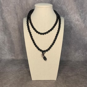 A FINE SANDALWOOD MADE NECKLACE