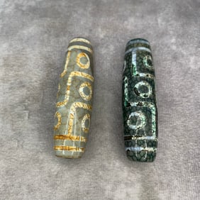 GROUP OF TWO TIBETAN BUDDHIST DZI TIAN ZHU PENDANT