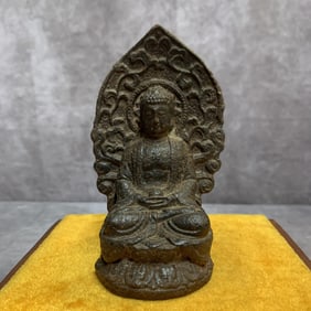 A SMALL CAST IRON AMITABHA STATUE